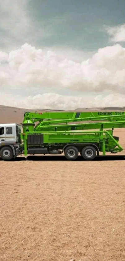 Vibrant green truck in a vast desert setting for mobile wallpaper.