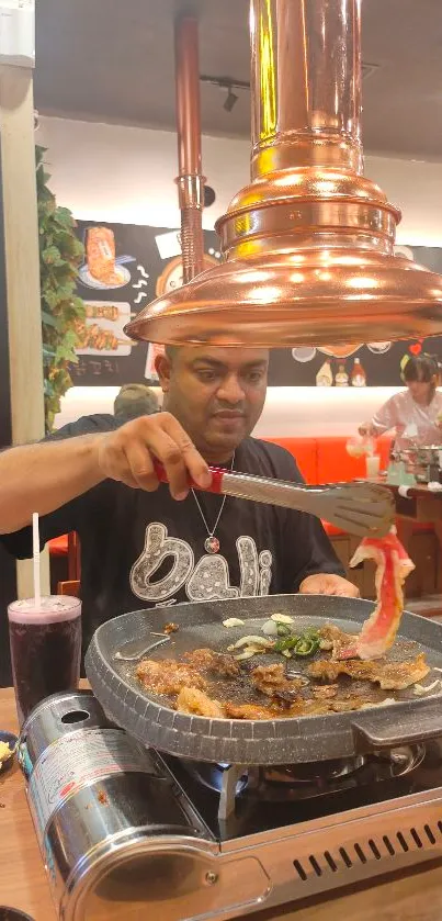 Man grilling meat in restaurant ambiance.