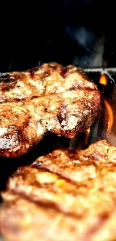 Sizzling steaks on a hot grill with flames.