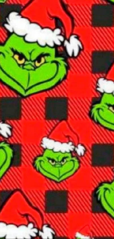 Grinch in Santa hat on red plaid background wallpaper.