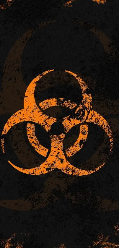 Grunge orange biohazard symbol on dark background.