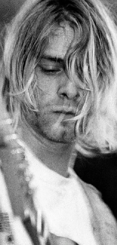 Black and white wallpaper of a grunge musician playing guitar.