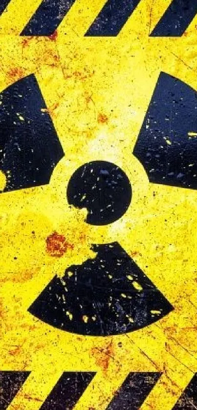 Grunge radioactive symbol on yellow background wallpaper.