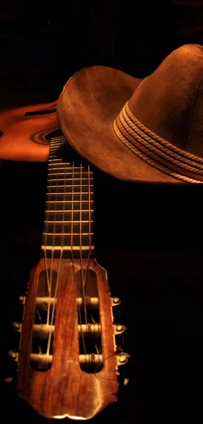 Guitar with cowboy hat in warm dark tones.