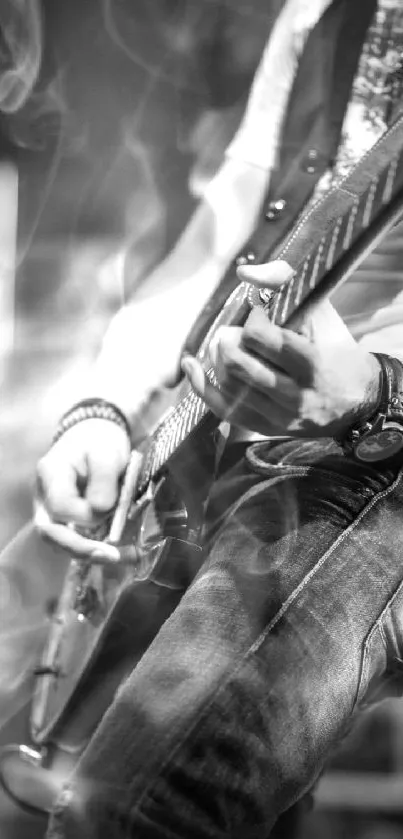 Black and white image of a rock guitarist playing passionately on stage.