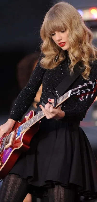 Guitarist in a dynamic live performance with flowing hair and stylish outfit.