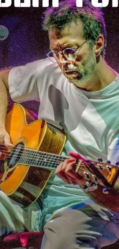 Guitarist performing live under colorful stage lights.