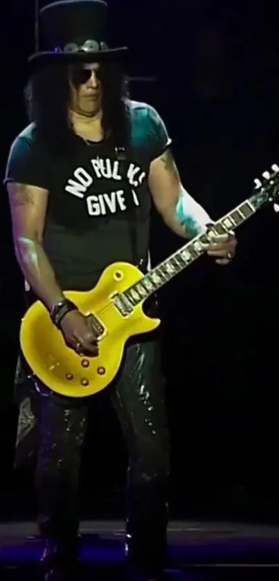 An iconic guitarist performs live with a yellow guitar, exuding rock vibes.