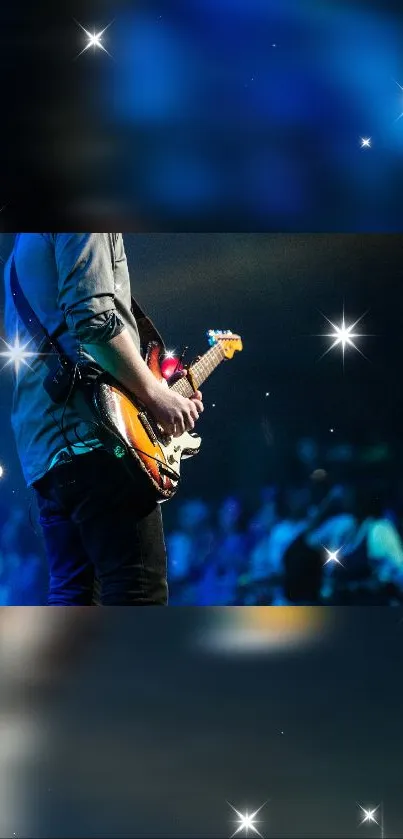 Guitarist performing on a starry stage with vibrant lights.