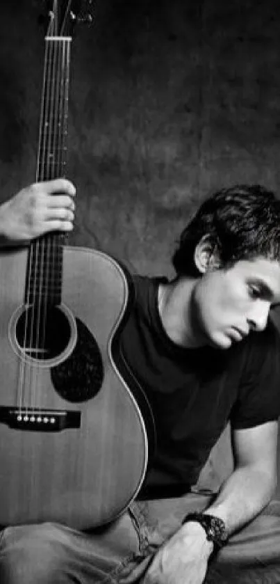 Black and white image of a guitarist with an acoustic guitar.