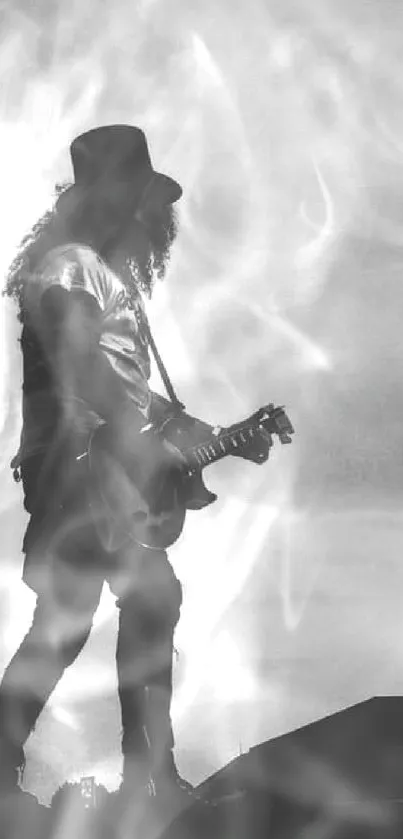 Silhouette of guitarist playing under a cloudy sky, creating a dramatic scene.