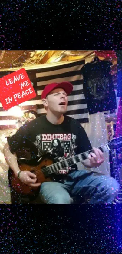 Guitarist in a red cap with artistic background.