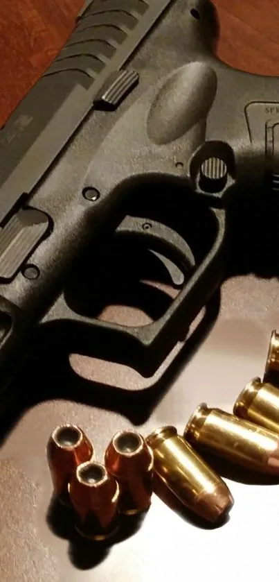 Dark gray pistol with brass bullets on a reflective surface.