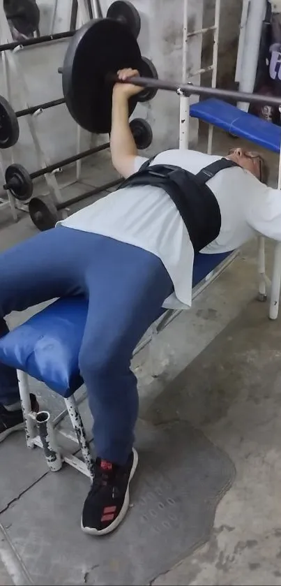 Person doing bench press in gym setting