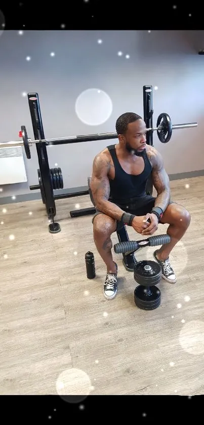 Man resting on gym bench with weights.