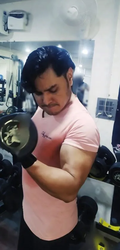 Man lifting weights in gym for fitness motivation.