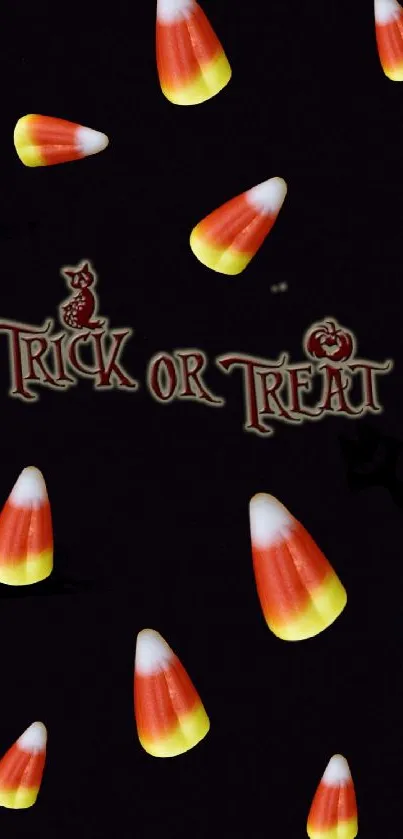 Dark Halloween wallpaper with candy corn and 'Trick or Treat' text.