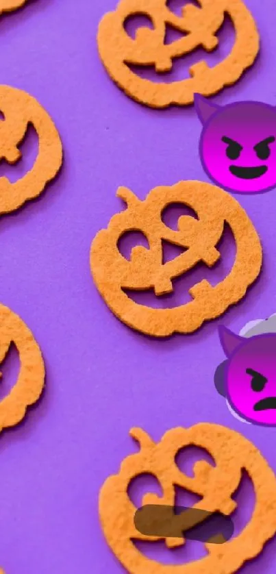 Halloween-themed wallpaper with pumpkins and purple emojis.