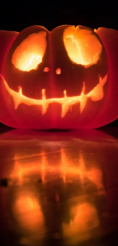 Glowing Jack-o'-lantern with a spooky face on a dark background.