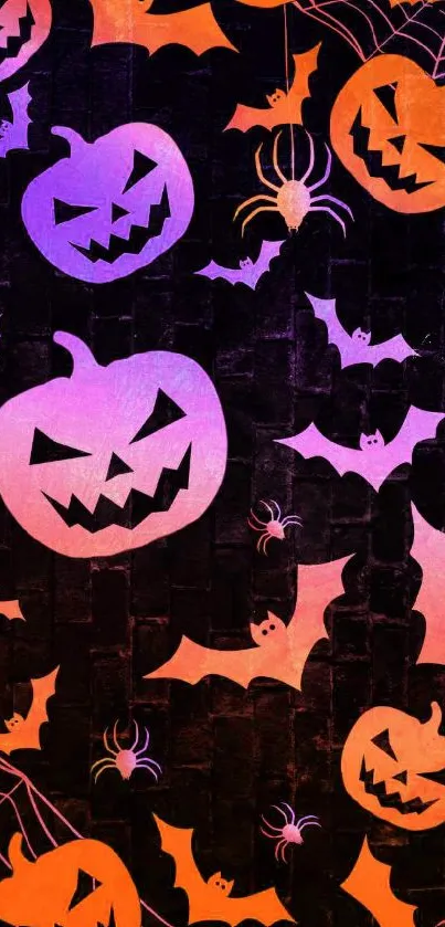 Spooky Halloween pumpkin wallpaper with bats, spiders, and dark background.