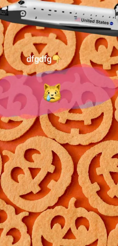Halloween-themed wallpaper with pumpkins, a space shuttle, and a cat emoji on orange background.