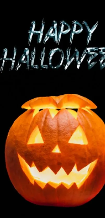 Tech-inspired Halloween wallpaper with glowing jack-o'-lantern above laptop.