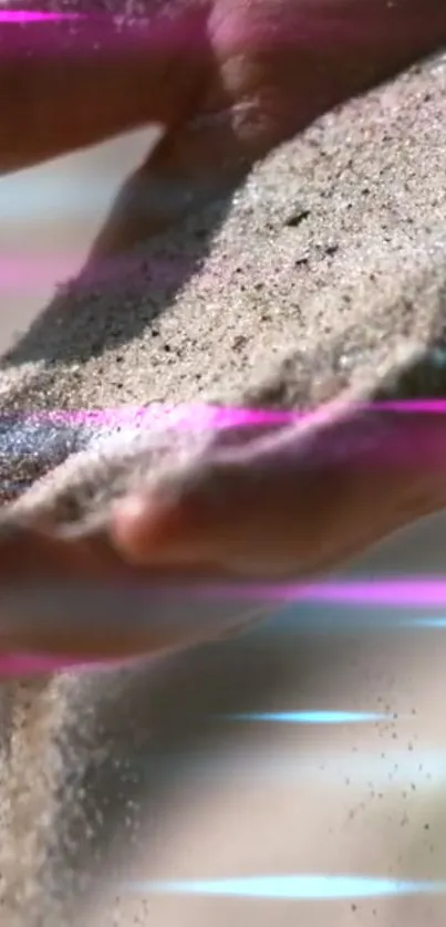 Hand pouring sand with neon streaks in vibrant wallpaper.