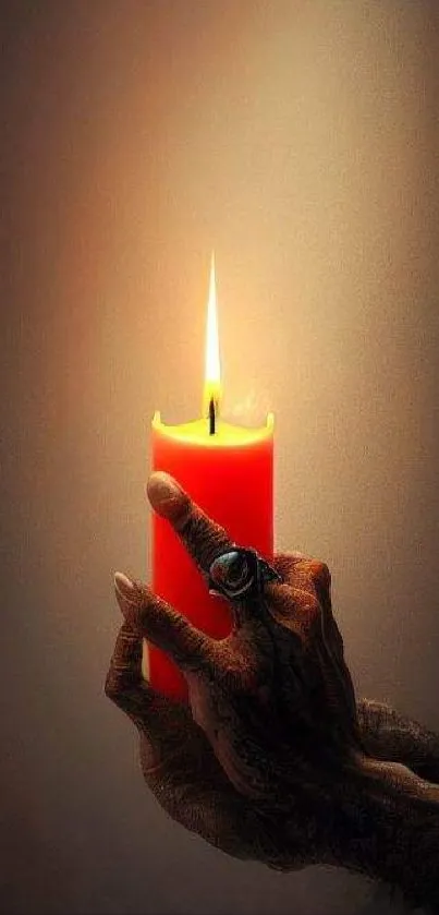 Hand holding a glowing red candle in darkness.