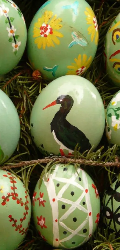 Hand-painted Easter eggs with intricate natural designs in mint green tones.