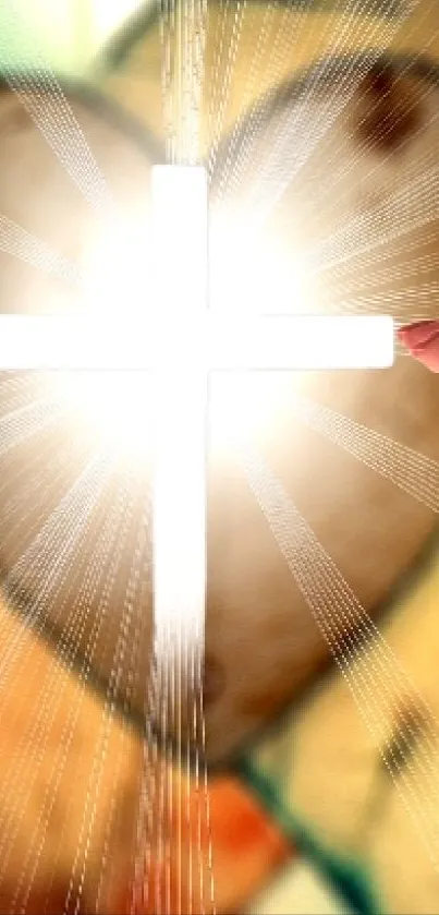 Two hands reaching towards a lit cross with heart shapes in the background.