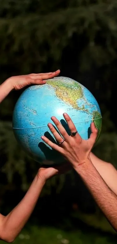 Hands supporting a globe against a dark background, symbolizing global unity.