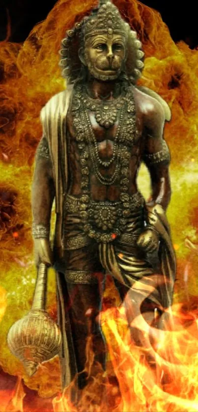 Hanuman statue in fiery orange flames background.