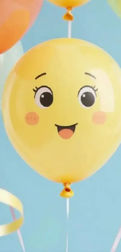 Yellow smiling balloon against blue sky.