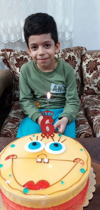 Smiling child with colorful birthday cake.