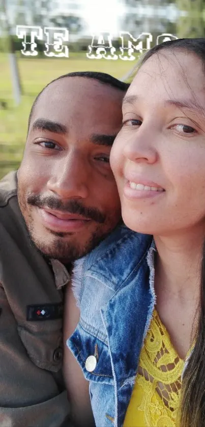 Smiling couple enjoying a sunny day in the park with love in the air.