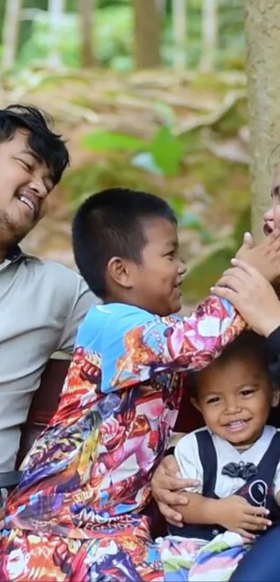 A family enjoys a joyful and playful moment together in a lush green setting.