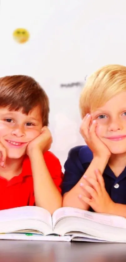 Two smiling kids reading a book together, enhancing learning joy.