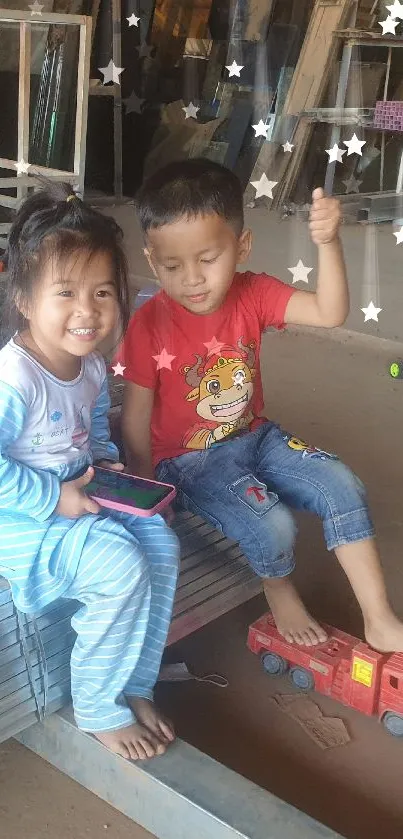 Children playing in a workshop with a toy truck, full of smiles and joy.