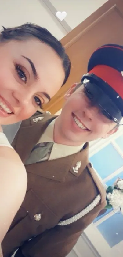 Smiling pair in uniform, bright setting.