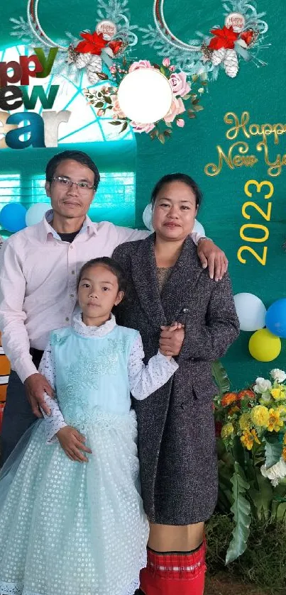 Family celebrating New Year 2023 with colorful decorations and balloons.