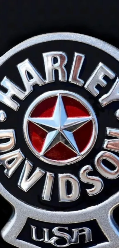 Harley Davidson logo with star in red and silver on black background.