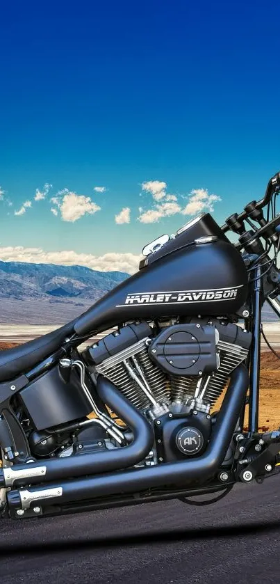 Harley-Davidson motorcycle on a desert highway under a blue sky.