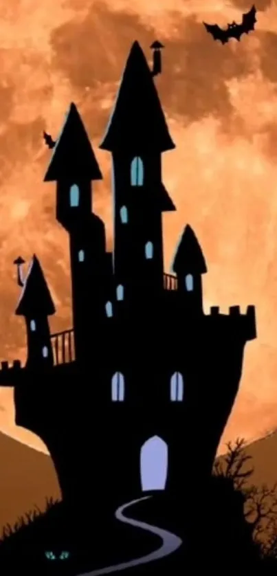 Silhouette of a haunted castle with bats under a full orange moon.