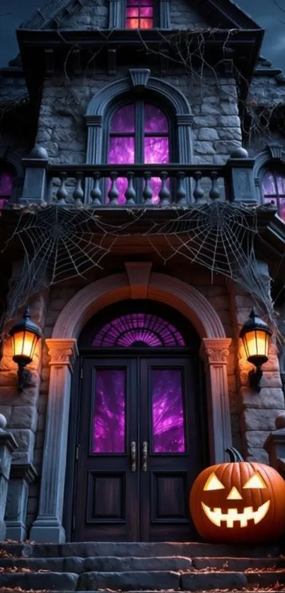 Haunted house with jack-o'-lantern glowing at night.