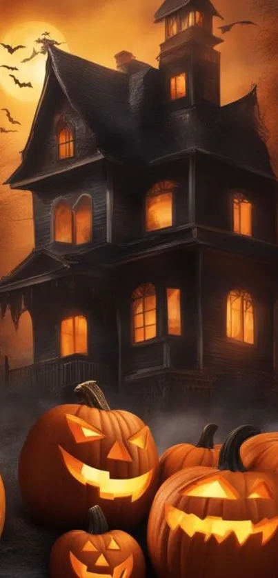 Halloween wallpaper with haunted house and glowing pumpkins.