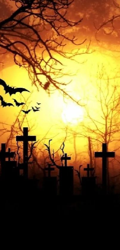 Silhouetted graveyard with bats at sunset, perfect for Halloween ambiance.