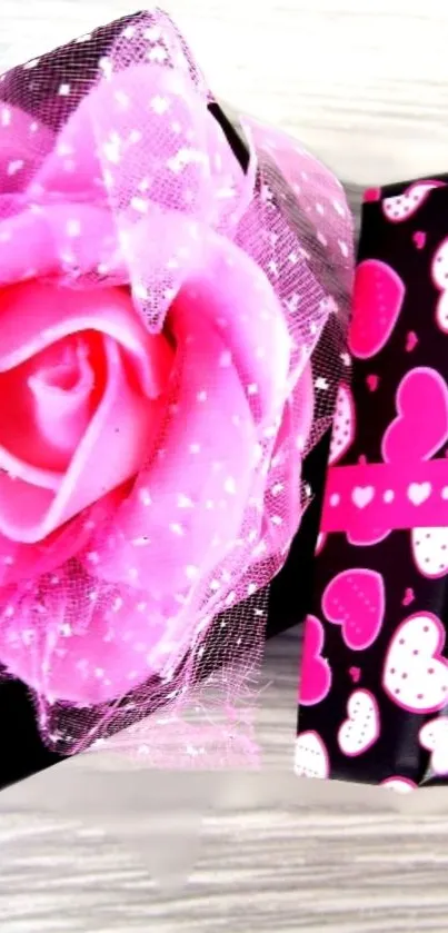Pink gift box with heart and ribbon