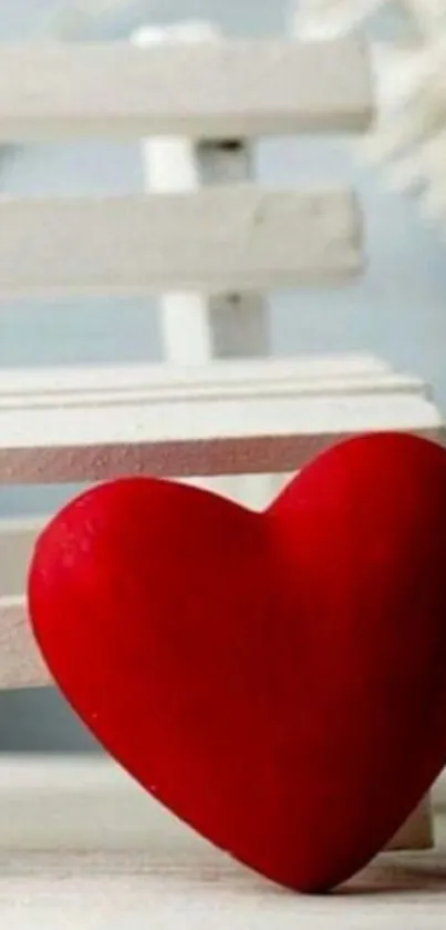 A red heart on a white bench wallpaper.