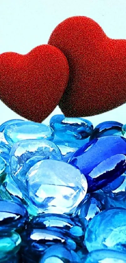 Two red hearts on blue stones with a serene background.