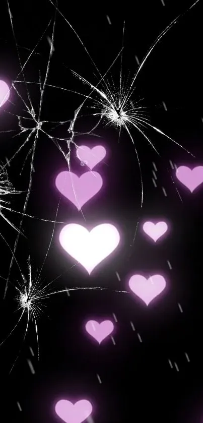 Mobile wallpaper with pink hearts and cracked screen on black background.